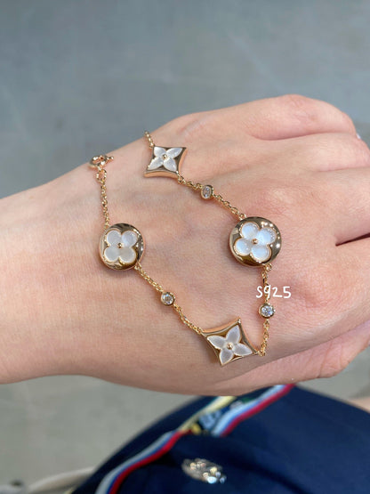 Miro STAR AND SUN 4 MOTIF WHITE MOP PINK GOLD BRACELET